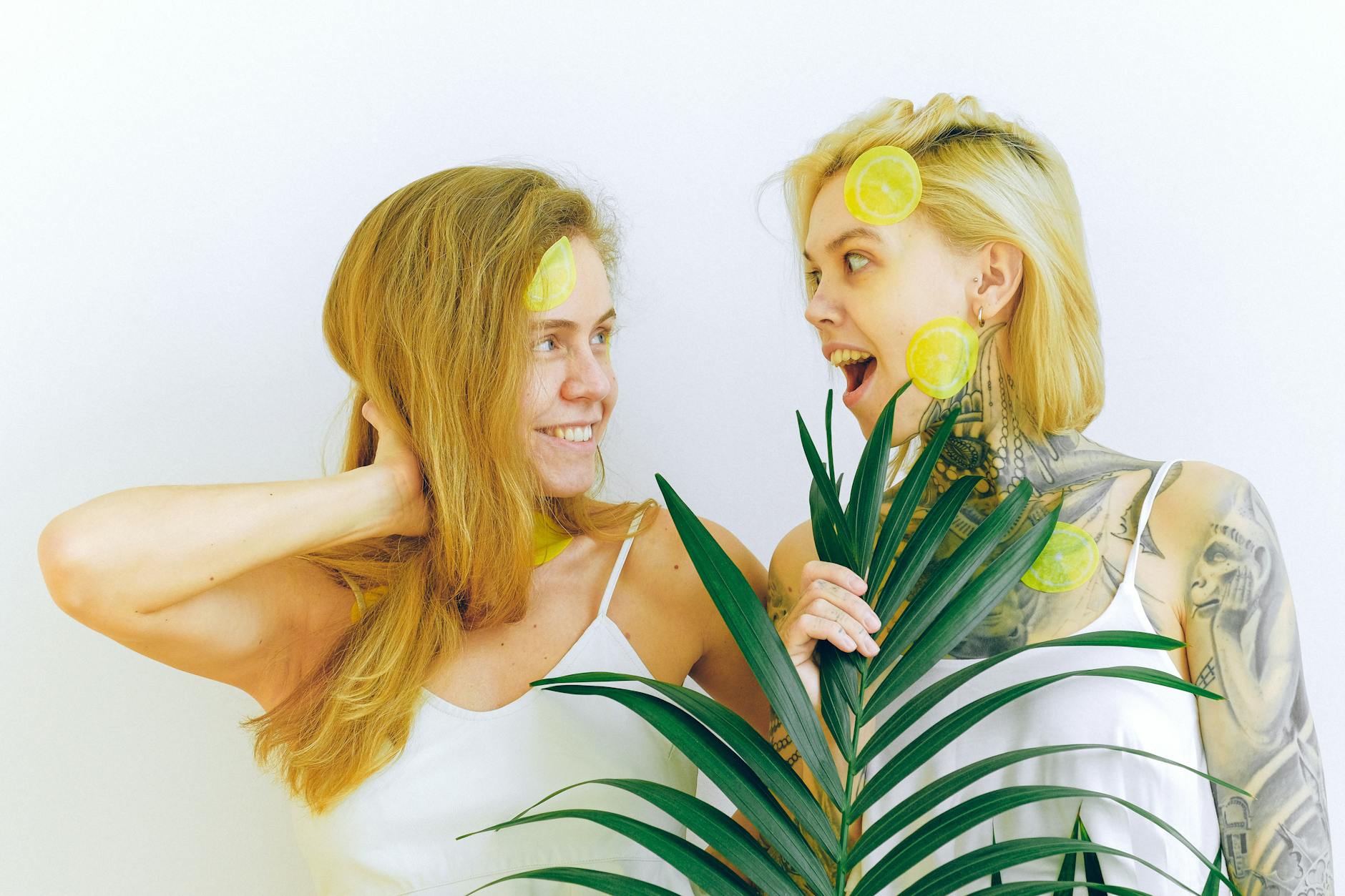 Two smiling women sharing a moment of joy and intimacy together